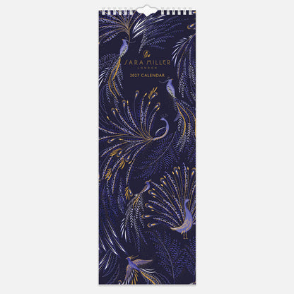 A slim hanging spiral bound wall calendar with intricate blue peacock design on the front with gold embellishment.