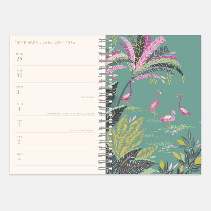 Spiral-bound planner with a tropical design featuring flamingos and palm leaves on a green background.