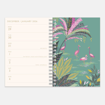Spiral-bound planner with a tropical design featuring flamingos and palm leaves on a green background.