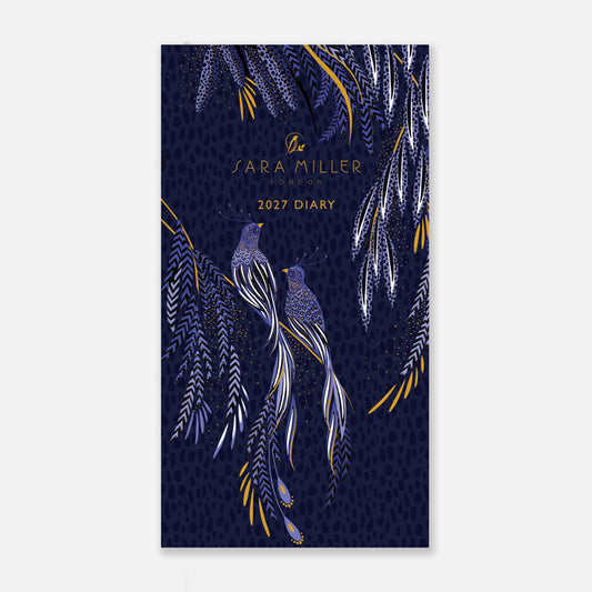 A small hard back pocket diary with blue peacock design on the front.