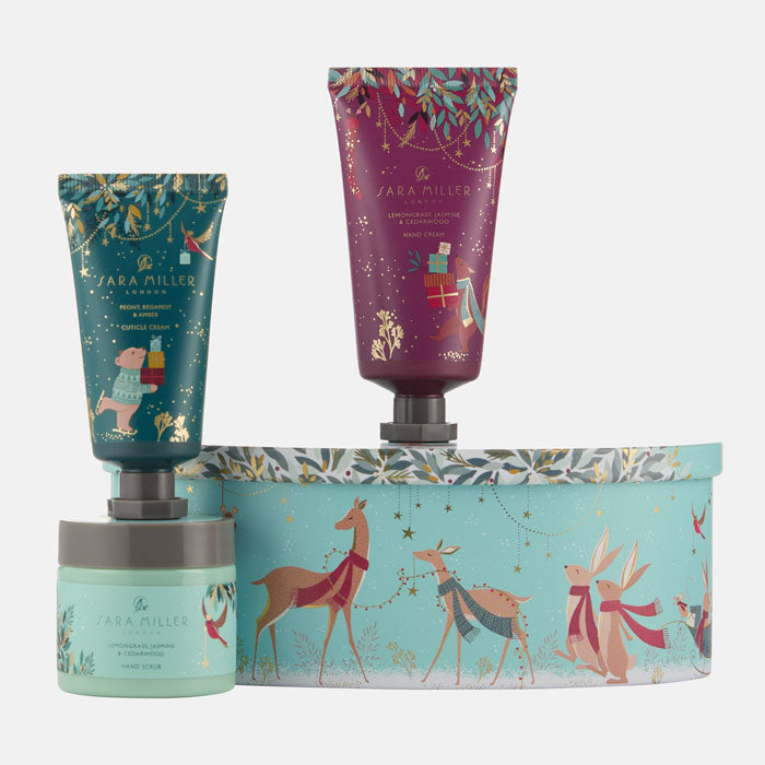 Set of skincare products with decorative packaging featuring animals and festive design.