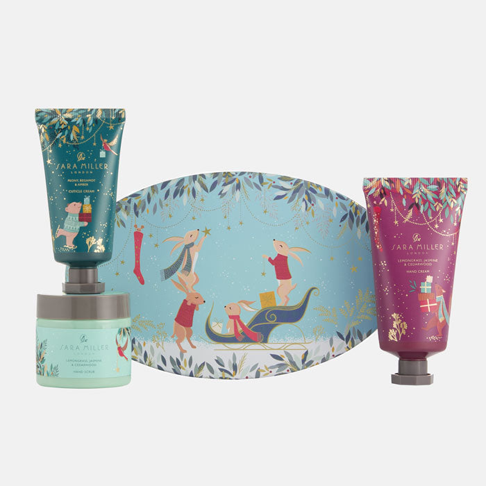 Set of skincare products with a decorative box featuring illustrations on a white background
