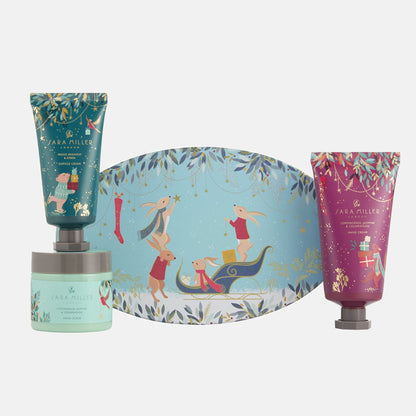 Set of skincare products with a decorative box featuring illustrations on a white background