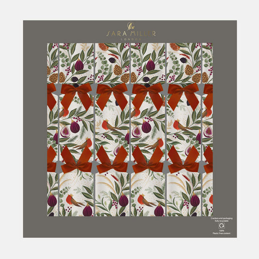 A box of cream Christmas crackers with festive foliage, figs and robins finished with red ribbons.