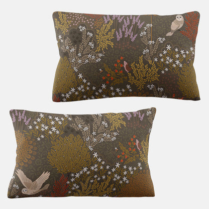 Two decorative pillows with foliage patterns on a white background