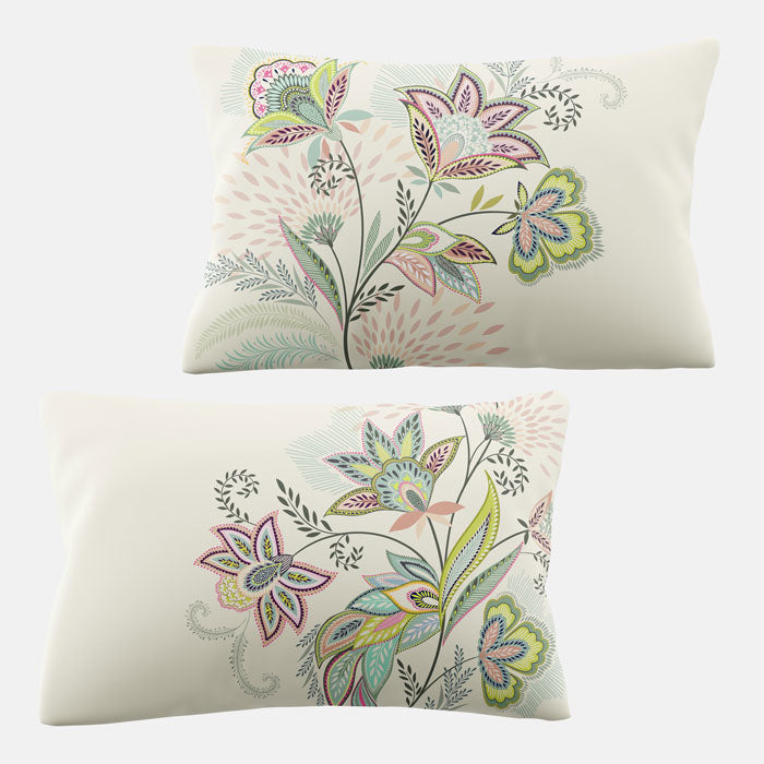 Two decorative pillows with floral patterns on a white background