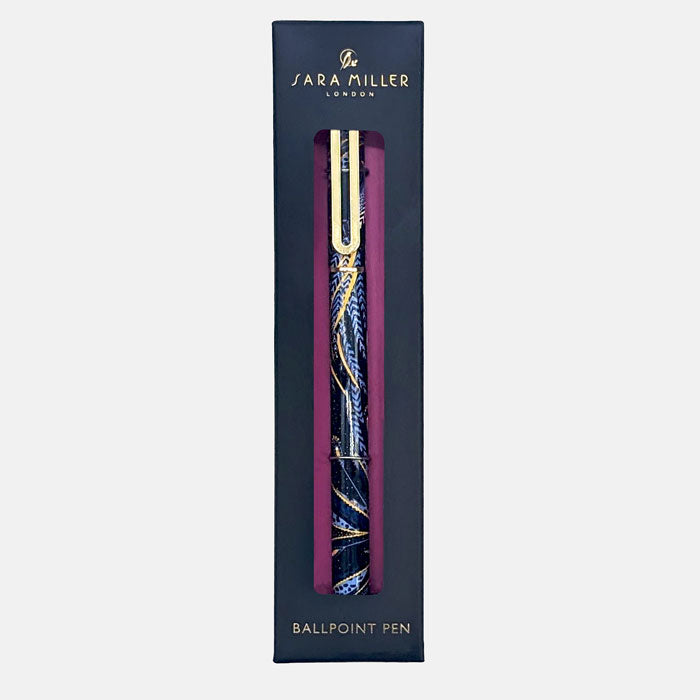 Ballpoint pen presented in box, with peacock feathers design in indigo and gold.