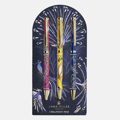 Set of three pens, one yellow, one cobalt and one fuchsia all in different floral designs on a decorative peacock design backing.