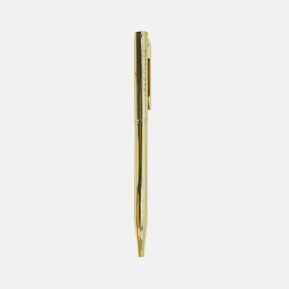 Gold pen with Sara Miller London logo, twist mechanism.