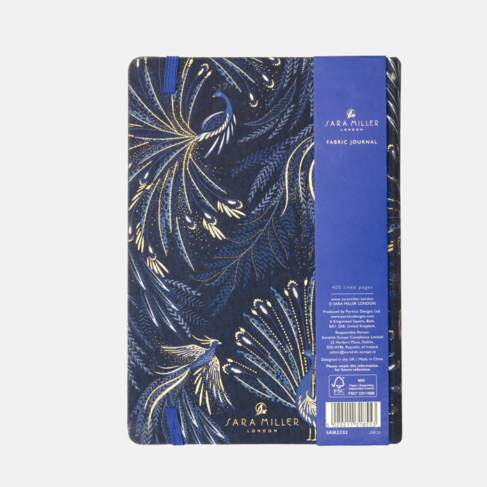 Notebook with peacock feather design on an indigo background with gold detailing, from the back.