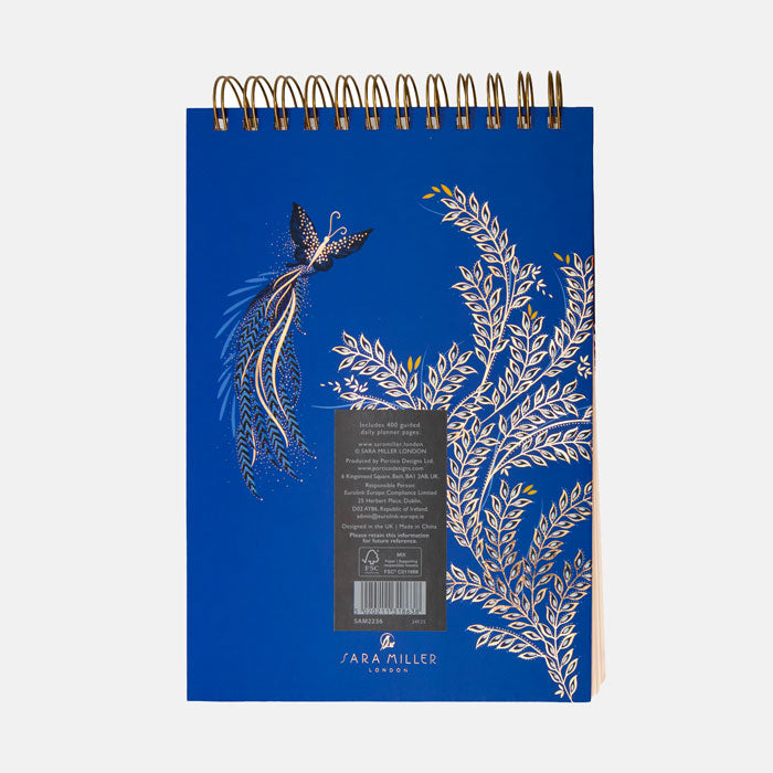 Back of daily planner with butterfly design on a cobalt blue background.