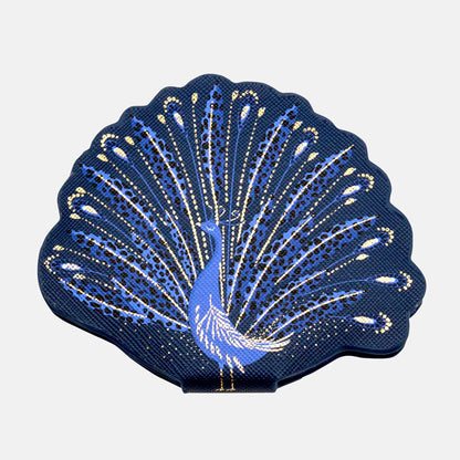 Compact mirror shaped like a peacock with blue and gold peacock design.