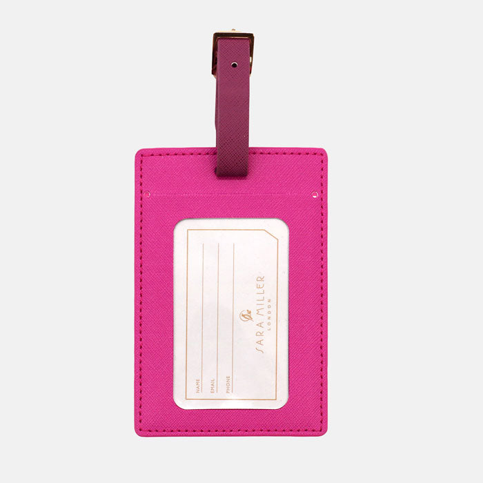 Back of luggage tag, shows space for name, email and phone number. Buckle fastening.
