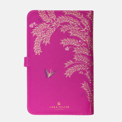 Back of fuchsia travel wallet, design continues to the back with Sara Miller London logo.