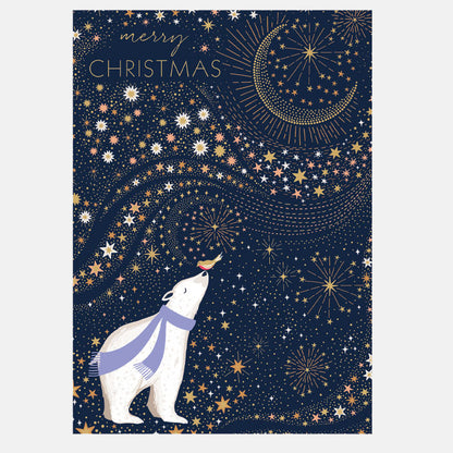 A festive Christmas greeting card featuring a polar bear wearing a purple scarf, looking up at a golden crescent moon and stars against a dark navy blue background. The text 'merry CHRISTMAS' is written at the top left.