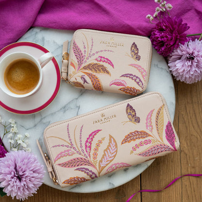 Large zip purse next to the small zip purse in the same design.