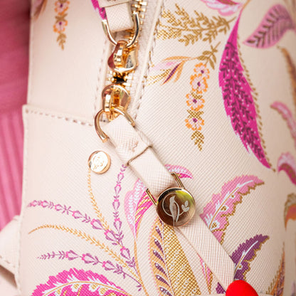 Close up of gold zips with etched Sara Miller London logo detail.