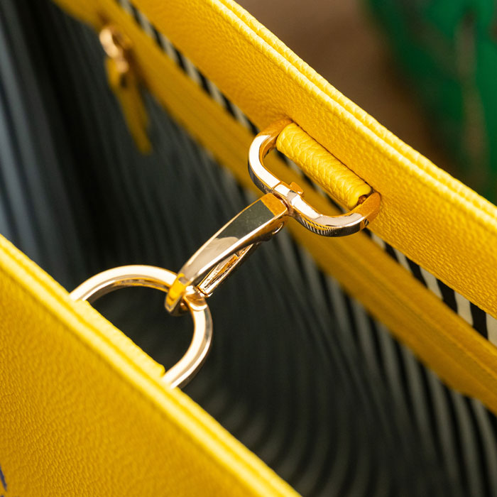 Close up of gold clip to keep bag closed