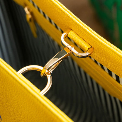 Close up of gold clip to keep bag closed
