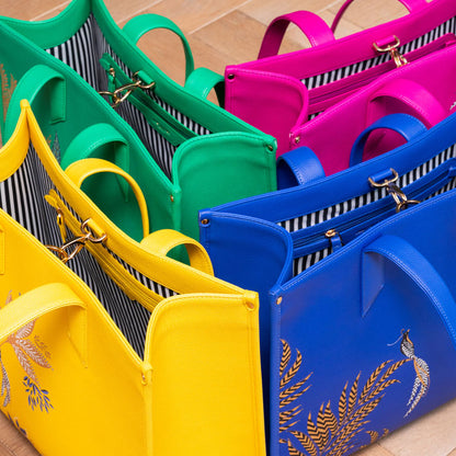 Bags from the same collection all together, in yellow, blue, pink and green.