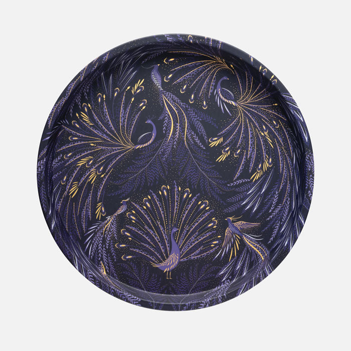 Round tin tray with peacock parade design, swooping tail feathers in velvety indigo.