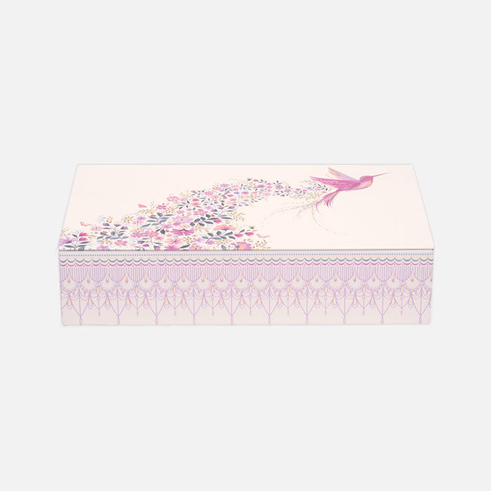 Small rectangular tin with hummingbird design and floral details, pink and beige shades.