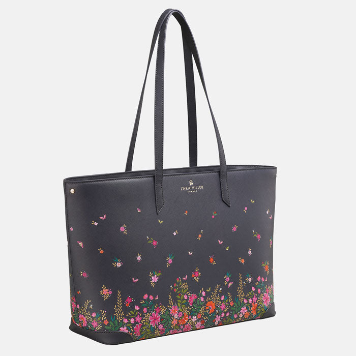 Ditsy floral large tote bag, long straps, deep navy blue colour. Side angle.