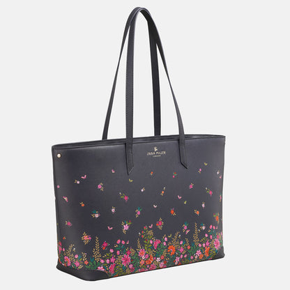 Ditsy floral large tote bag, long straps, deep navy blue colour. Side angle.