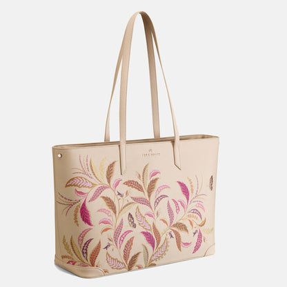 Cream tote bag with floral pattern.