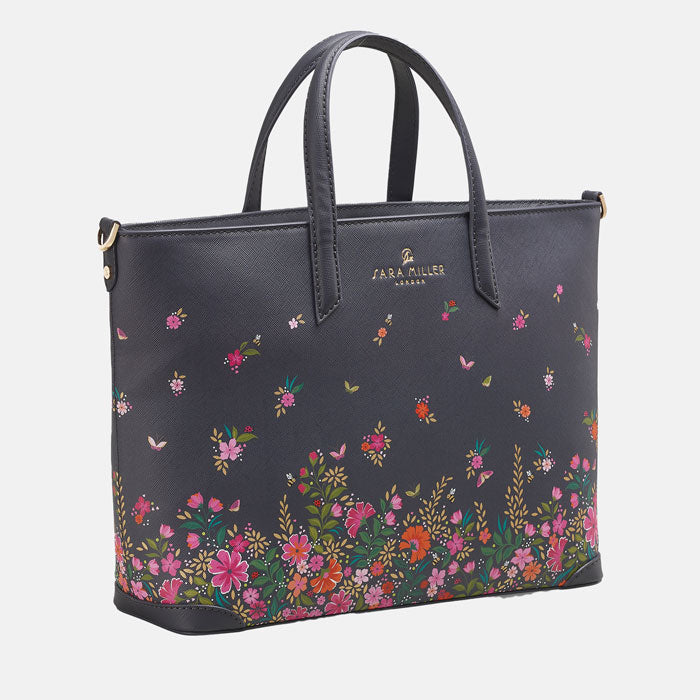 Ditsy floral medium tote bag with delicate floral design, white background.