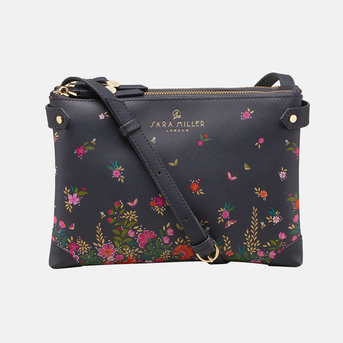 Ditsy floral crossbody bag from the front, white background.