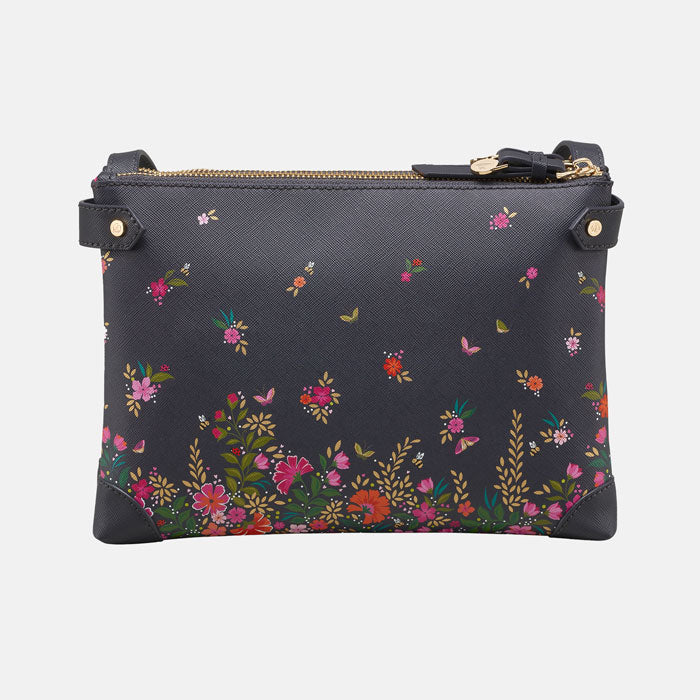 Ditsy floral crossbody bag from the back, pattern continues. White background.