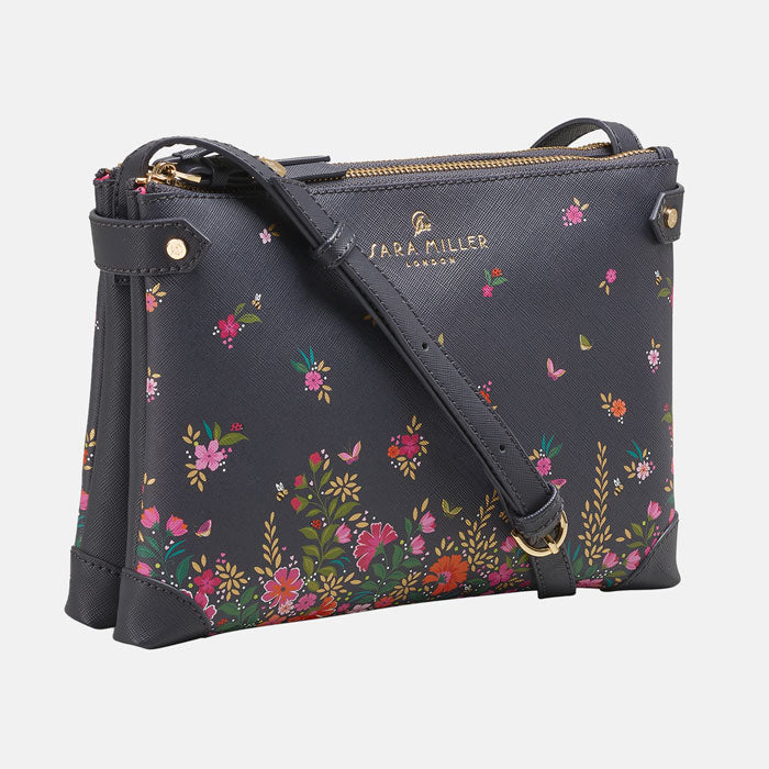 Ditsy floral crossbody bag from the front, white background.