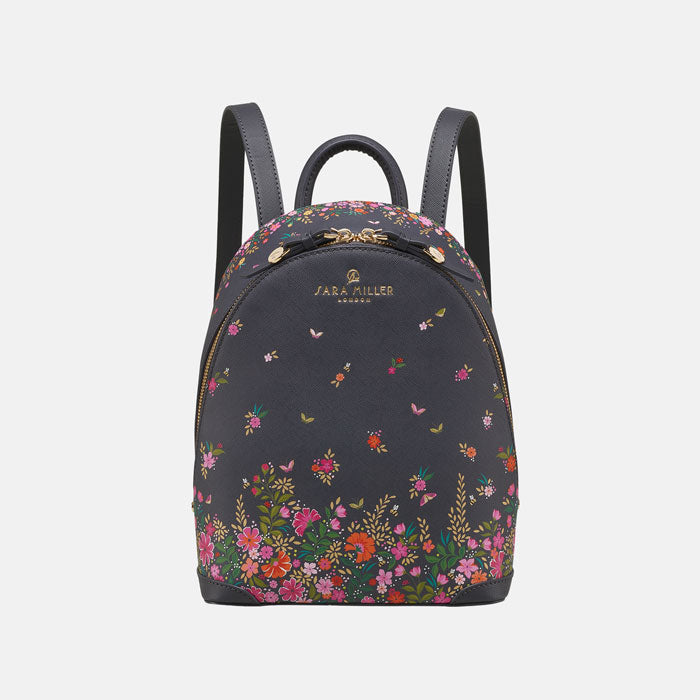 Ditsy floral mini backpack from front, white background.