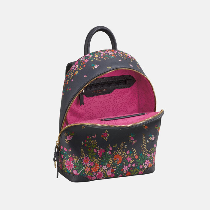 Ditsy floral mini backpack from front, can see it open with pink interior. White background.
