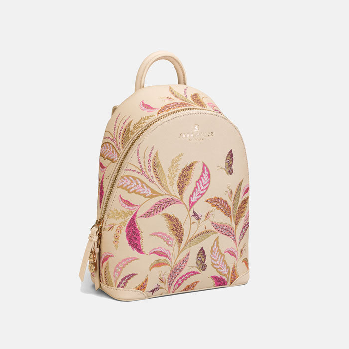 Cream mini backpack with floral design.