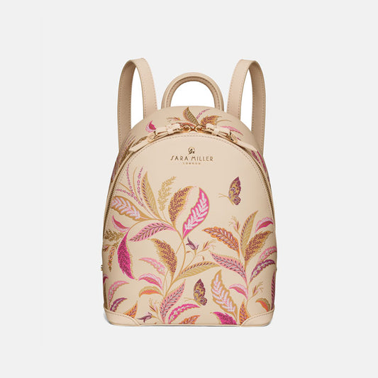 Cream mini backpack with floral design.