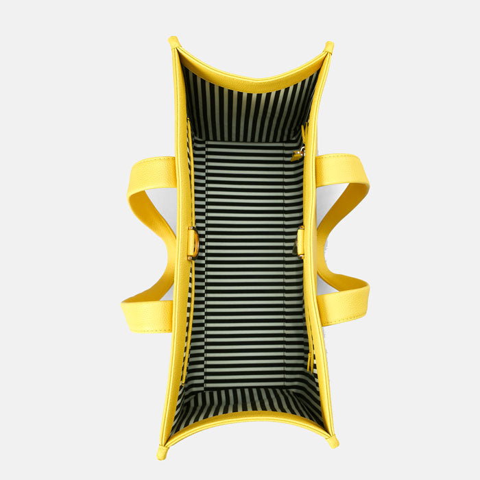Inside of bag, shows black and white striped lining and clip closure.