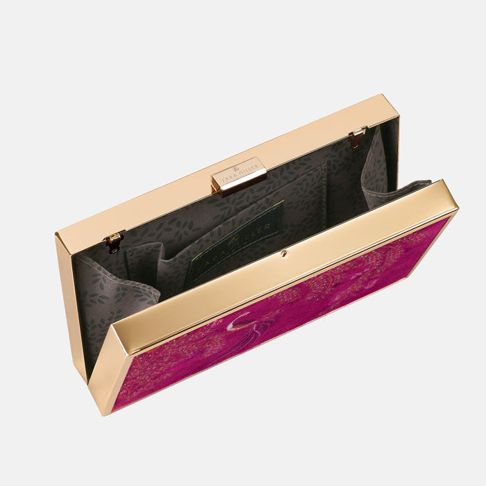 Inside of clutch bag, shows light grey lining with delicate floral pattern