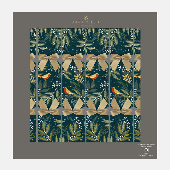 Christmas crackers with decorative pattern featuring bows, birds, and foliage on a dark green background.