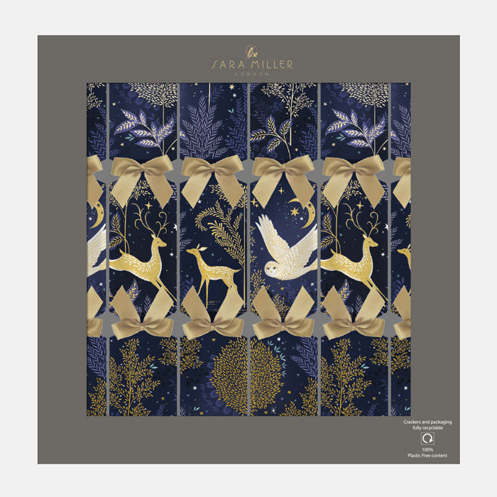Decorative Christmas crackers with deer, bow, and star pattern on a blue background.