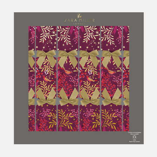A box of plum Christmas crackers with winter foliage, berries and robins finished with gold ribbons. 