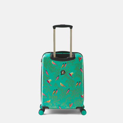 A hard-shell spinner suitcase in a vibrant  green, decorated with a pattern of colourful birds in pink, yellow, and orange. The suitcase features an extended telescopic handle, four multi-directional wheels, and a small round brand logo on the back.