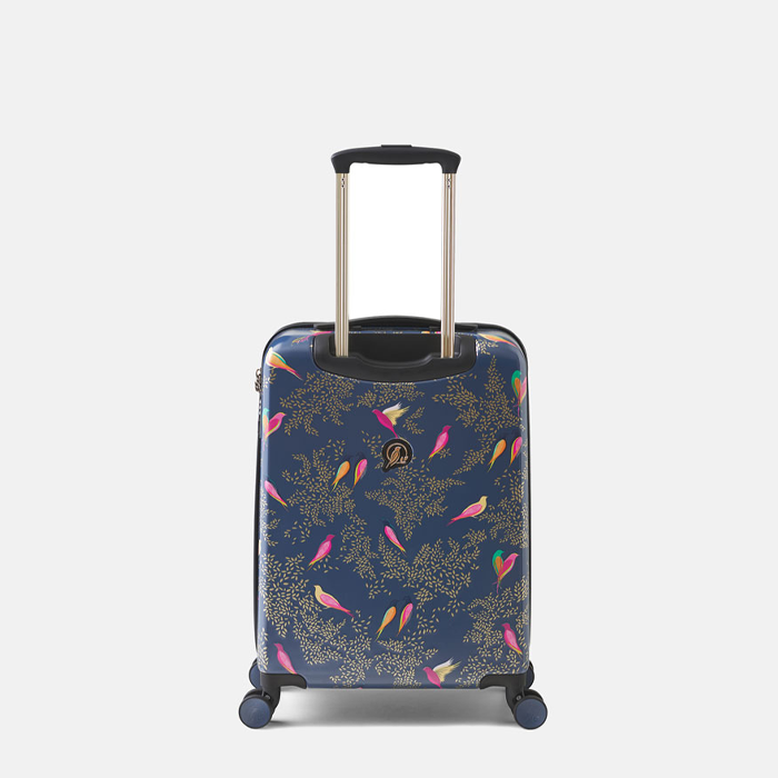 A navy blue hard-shell suitcase with colourful bird motifs, featuring an extended telescopic handle and four wheels, shown against a light grey background.