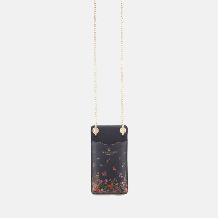 Phone pouch from further away to see more of gold chain strap.