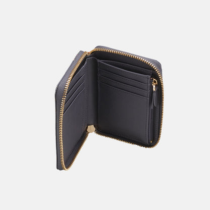 Inside of purse, plain blue material same as outside with internal zip pocket and various card holders.
