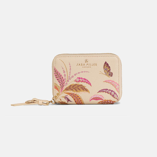 Small zip purse with floral design and gold zip.
