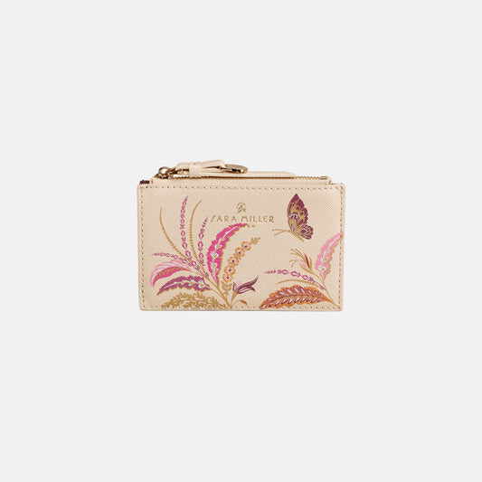 Cream card holder with floral design and zip top coin compartment.
