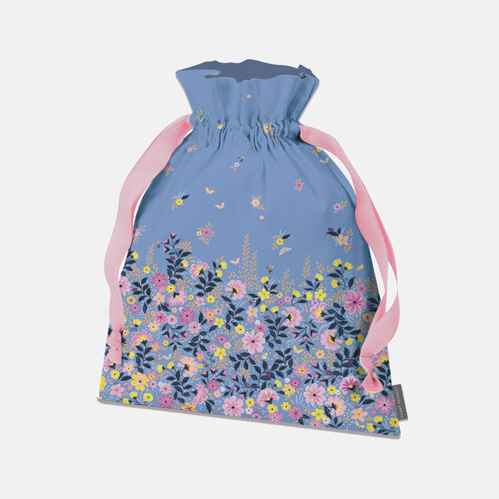 Drawstring bag with floral pattern and pink straps on a light blue background.