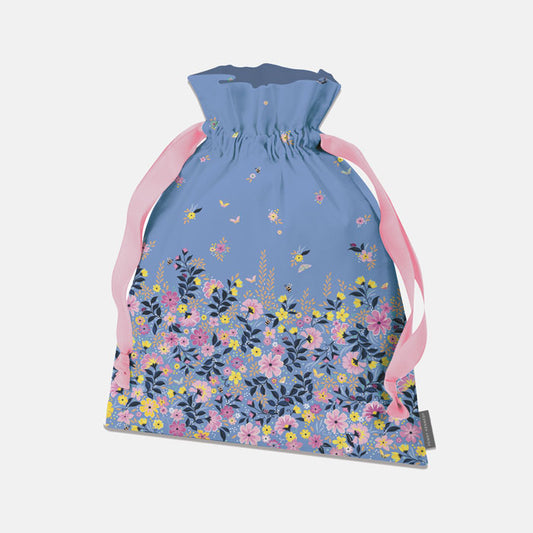 Drawstring bag with floral pattern and pink straps on a light blue background.